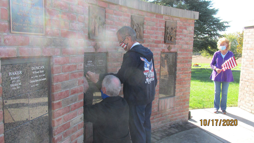 Brothers Frank & Michael assist with the columbarium.