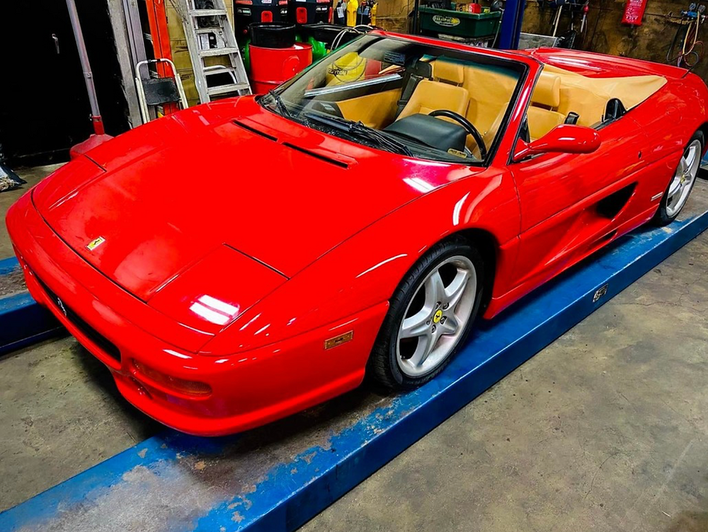 Red 1995 Ferrari Spyder convertible