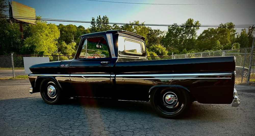 Shiny black 1966 Chevrolet C-10 pickup