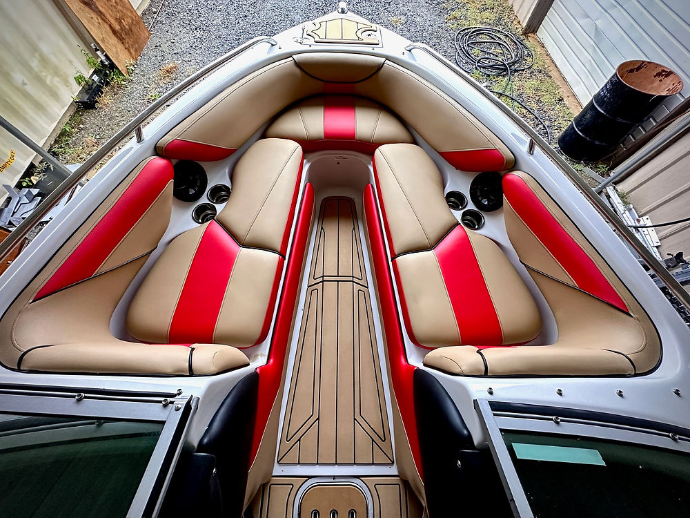 Marine boat interior with tan and red seating