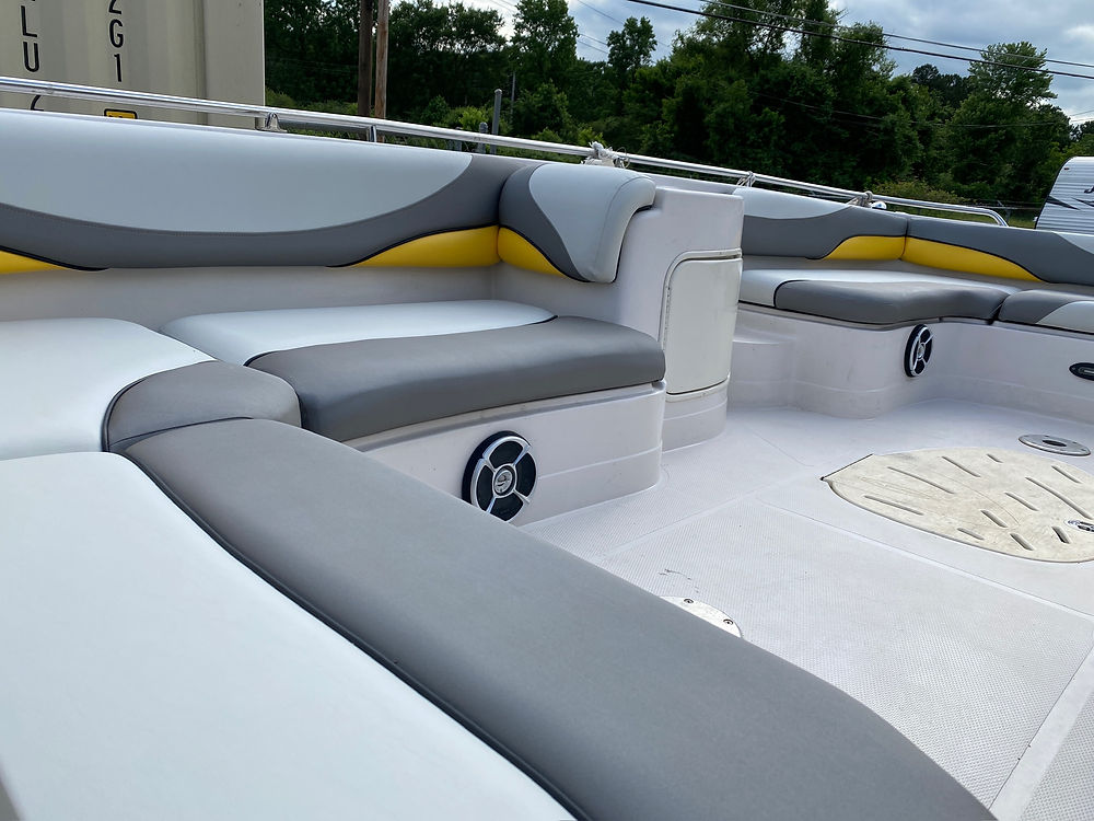 Marine boat interior with gray, white, and yellow seating