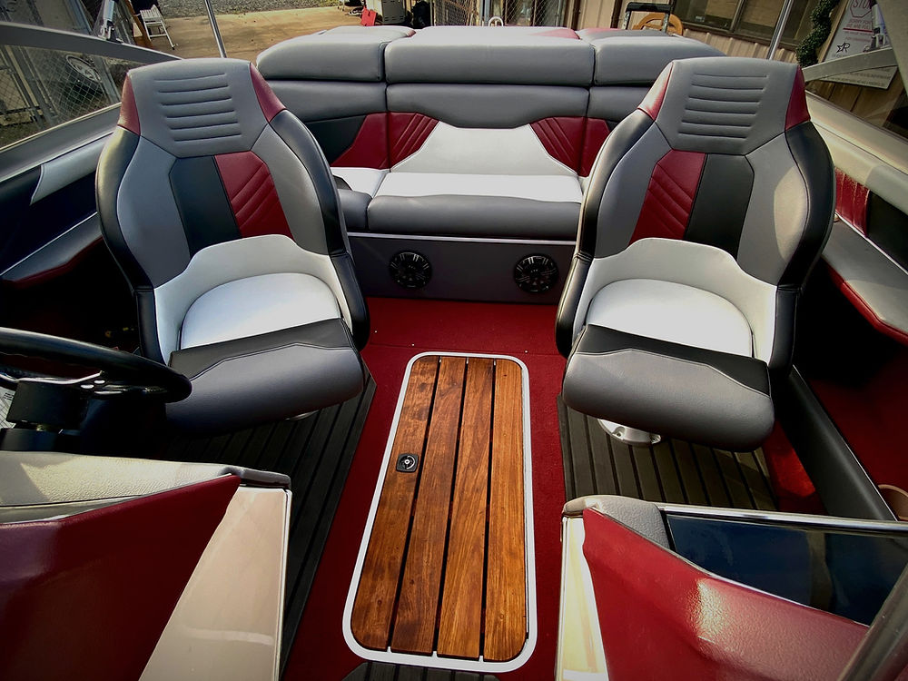 Modern marine boat interior with red and gray seats