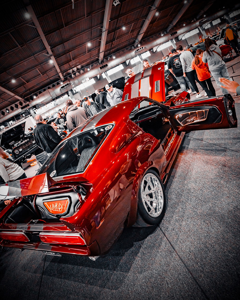 Red 1967 Eleanor with open door and trunk at car show