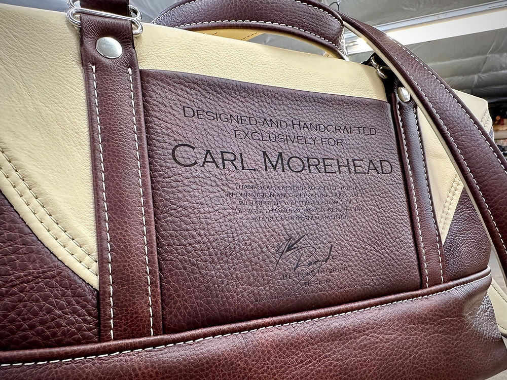 Bespoke leather bag with 'DESIGNED AND HANDCRAFTED EXCLUSIVELY FOR CARL MOREHEAD'