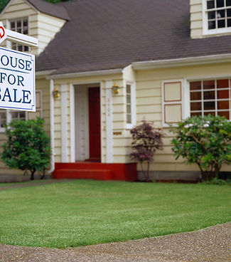 home with sold real estate sign