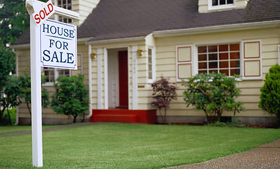 Sold sign in front of house