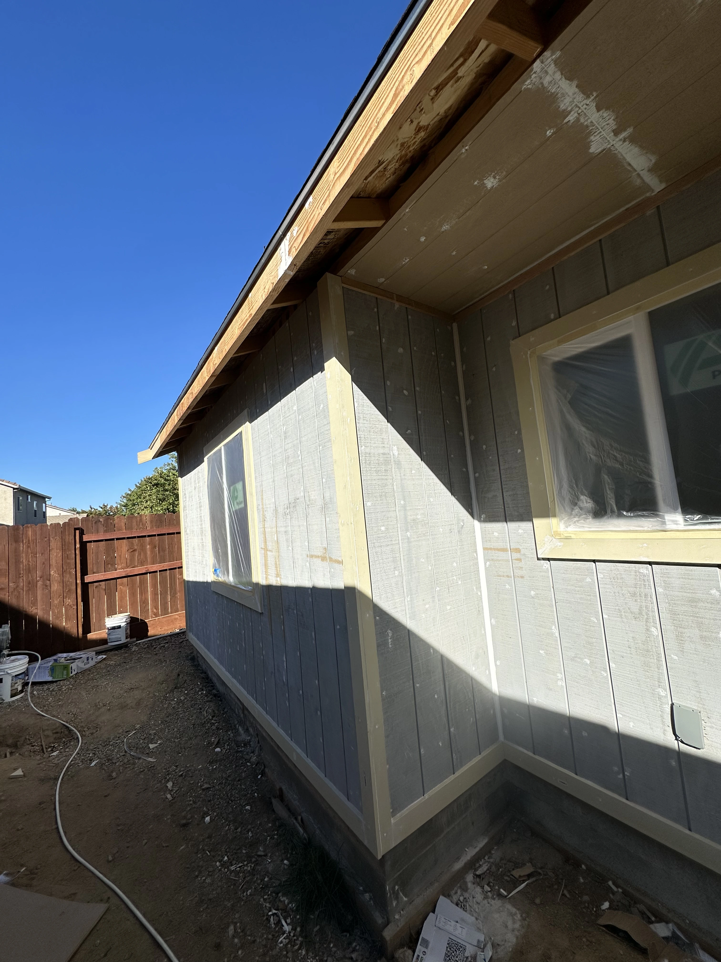 Rocklin CA home exterior stucco painting and trim refinishing by professional painters.