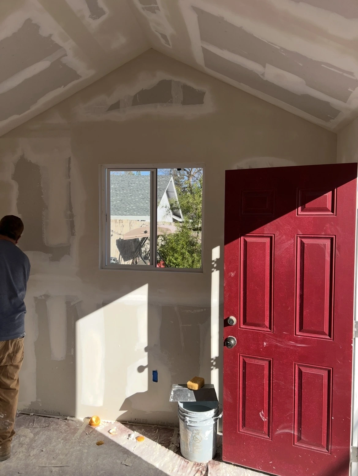 Drywall installation and finishing inside converted shed studio