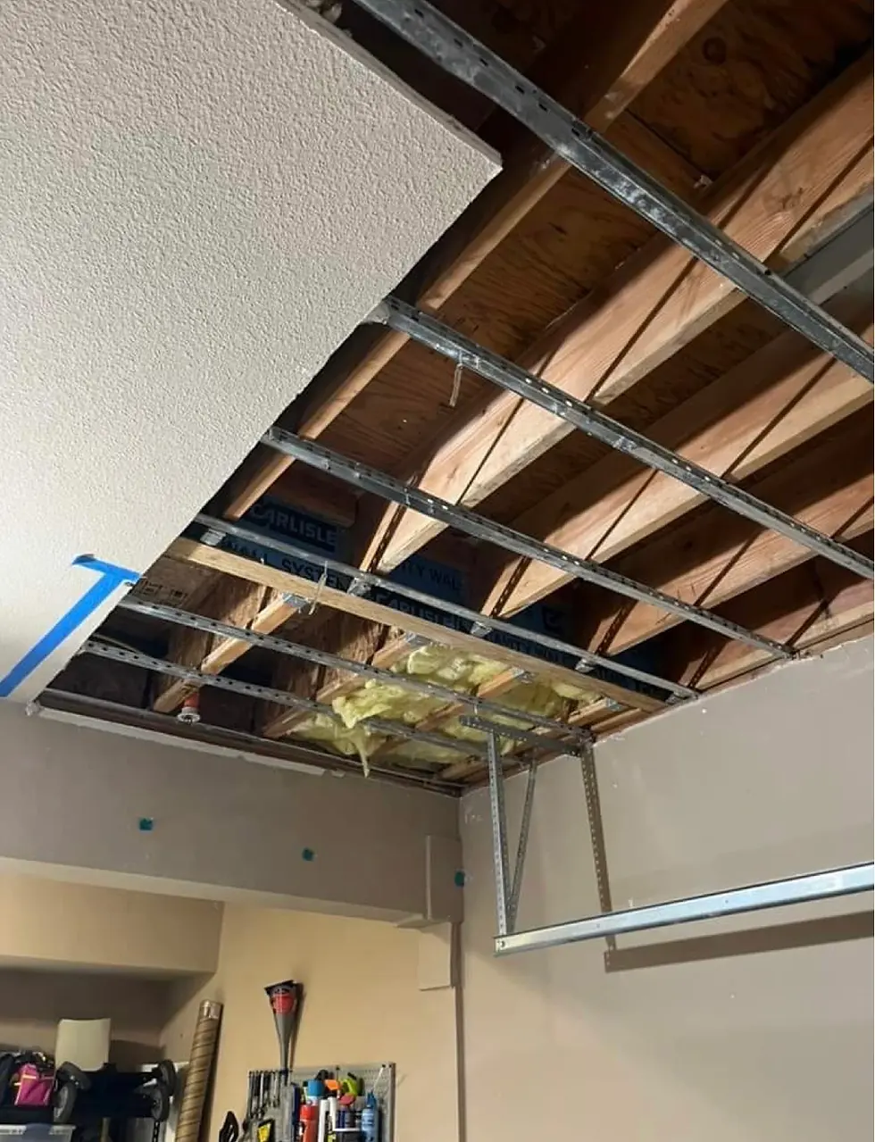 Water damage stain on a sheetrock garage ceiling caused by a hidden roof leak in Lincoln, CA.