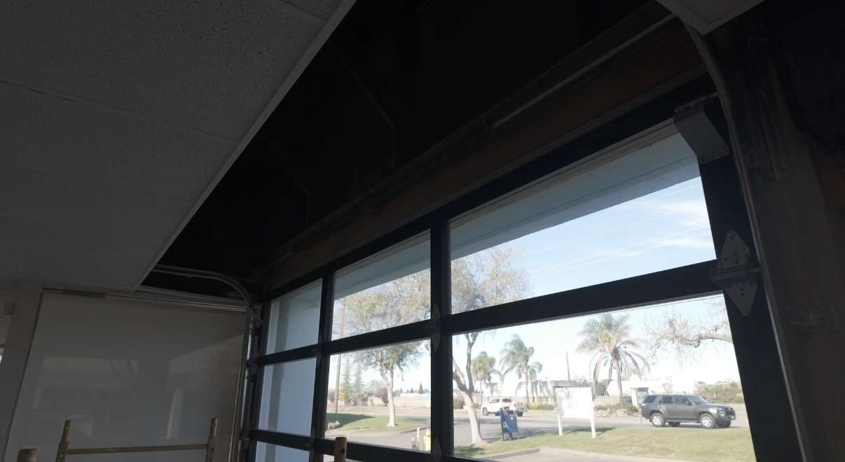 T-bar suspended ceiling repair in Granite Bay CA commercial building after tenant roll-up door installation caused ceiling damage
