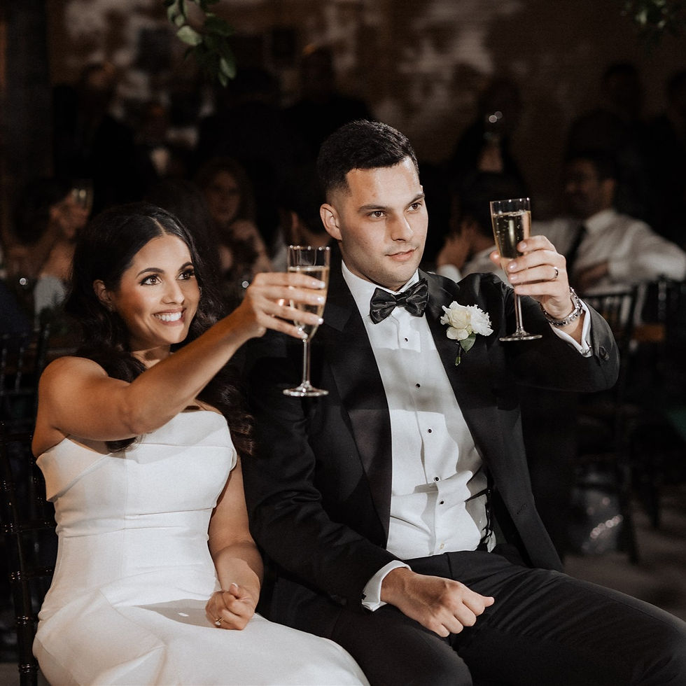 Happy newlyweds celebrating their dream wedding planned on a realistic budget