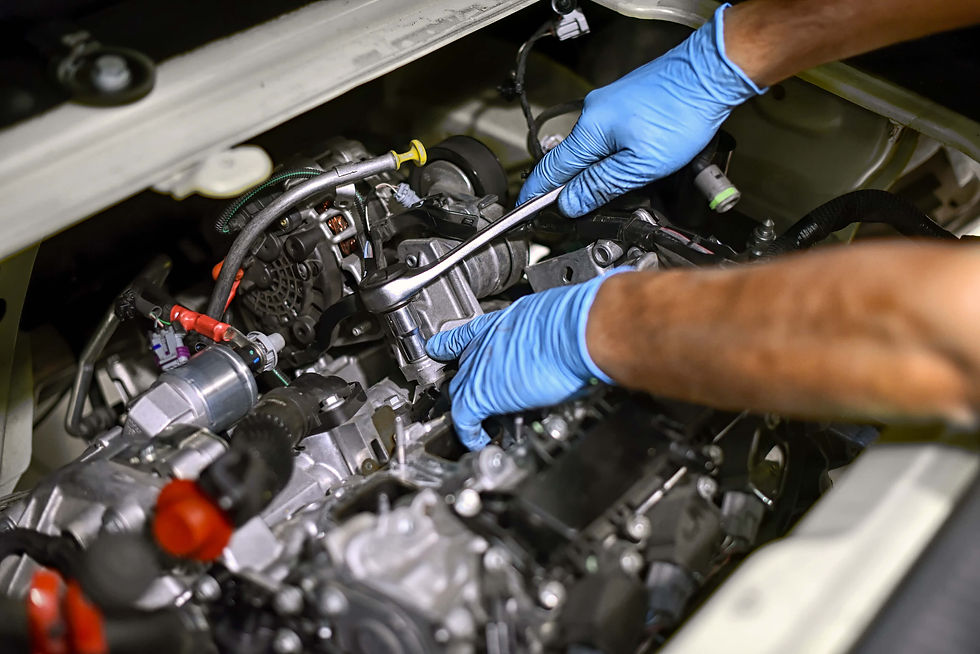 hands-of-a-mechanic-working-on-a-car-engine.jpg