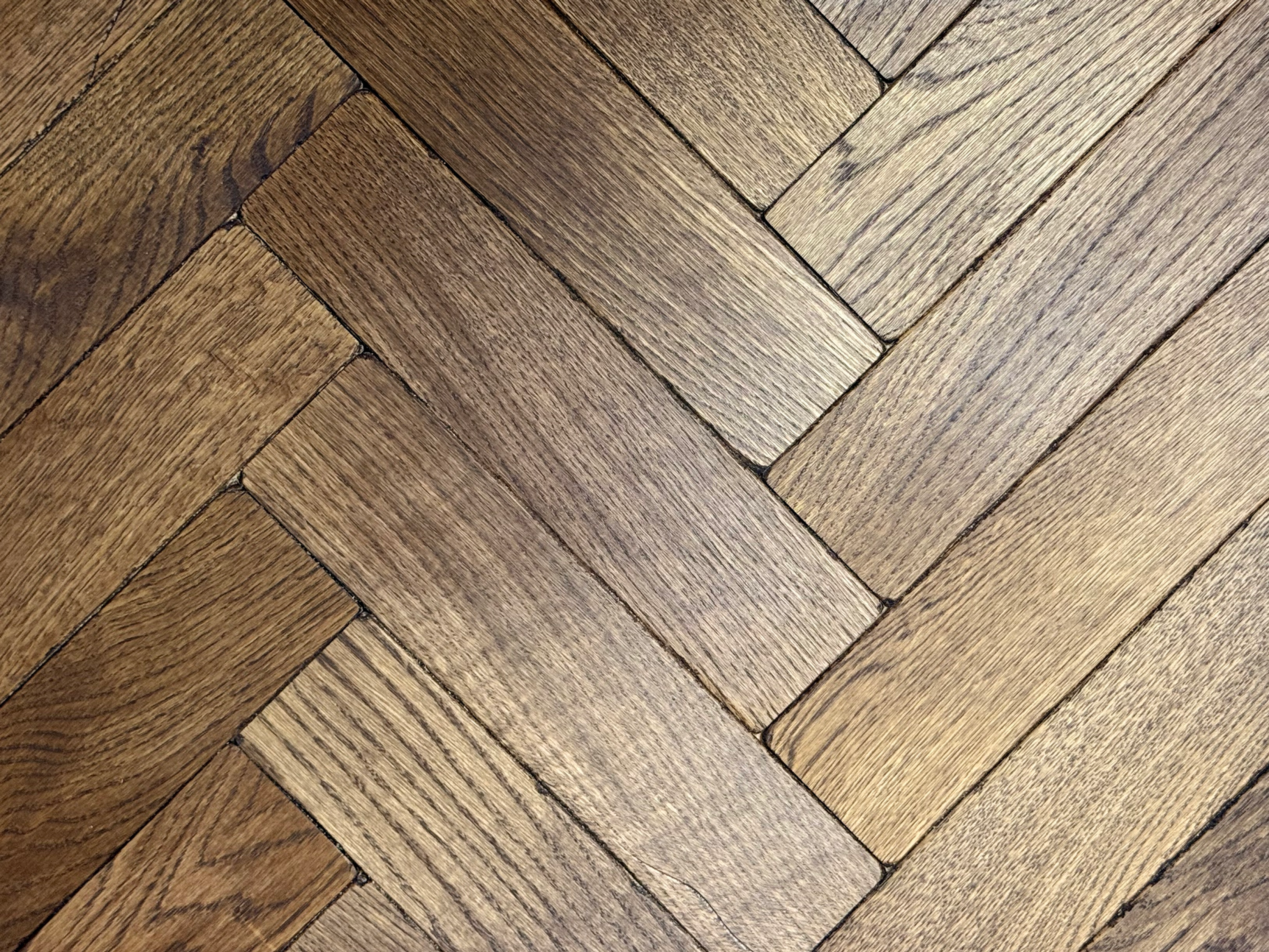 Vintage oak parquet coffee. Brown herringbone flooring
