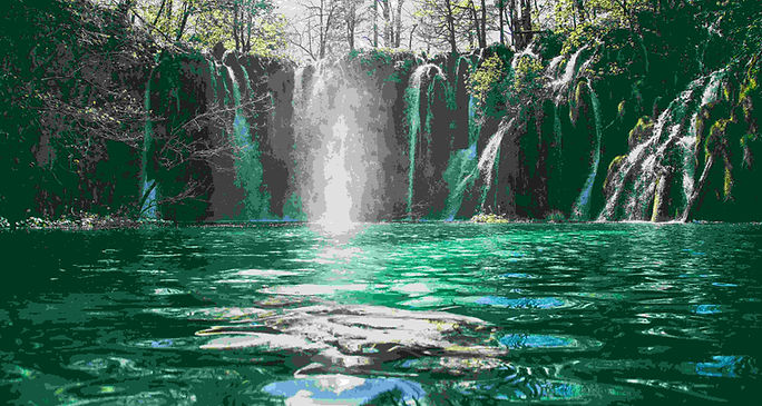 A serene waterfall cascades through a lush forest, showcasing nature's beauty for an ESL speaking lesson on natural wonders.