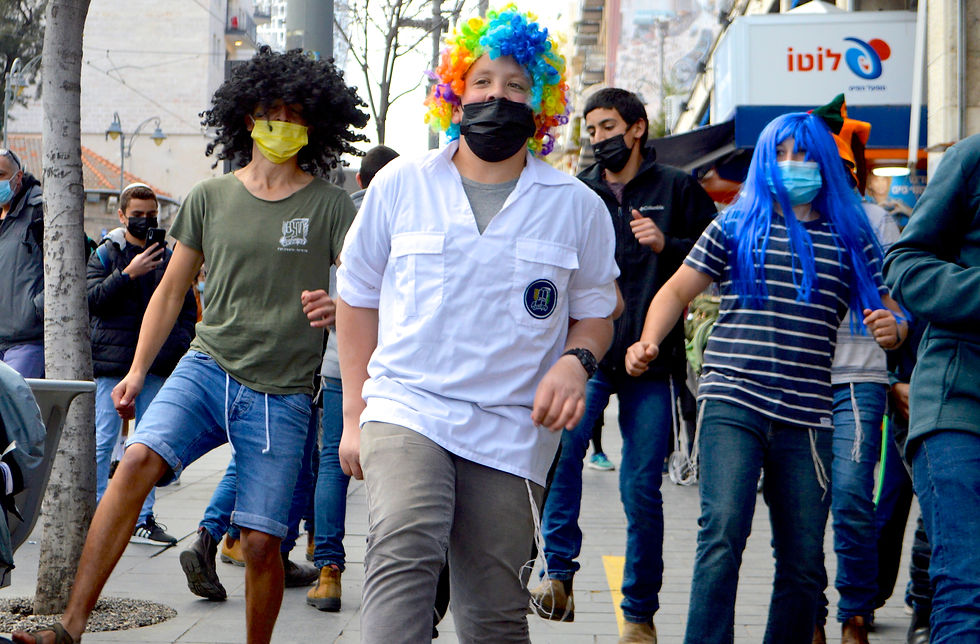 Dressing up is an important part of Purim.These students sing and dance on the streets of Jerusalem, near Mahane Yehuda (Daniel Santacruz)