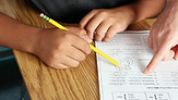 Teacher Helping Student