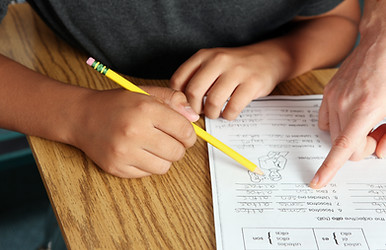 Teacher Helping Student
