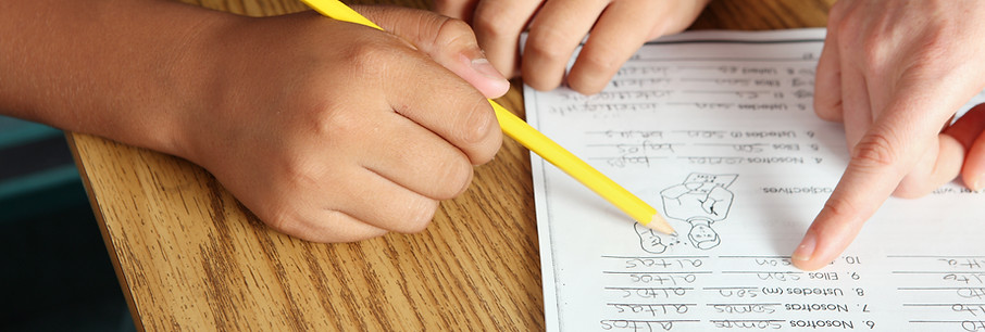 Teacher Helping Student