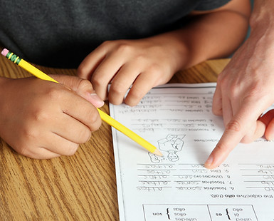 Teacher Helping Student