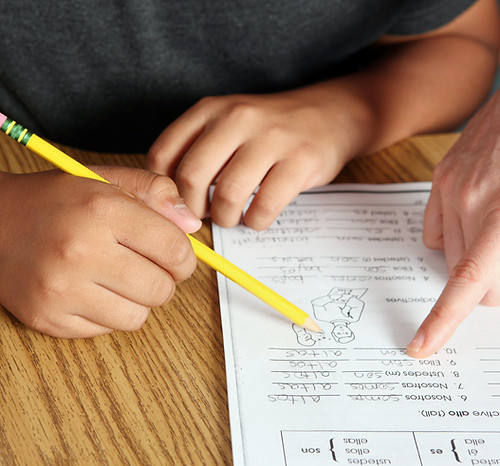 Teacher Helping Student
