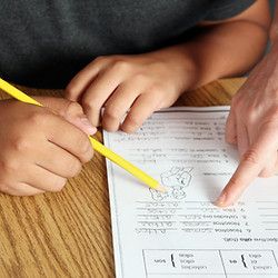 Teacher Helping Student