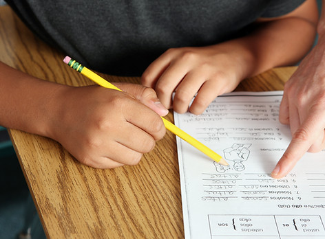 Teacher Helping Student