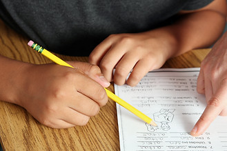 Teacher Helping Student