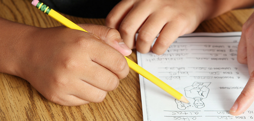 Teacher Helping Student
