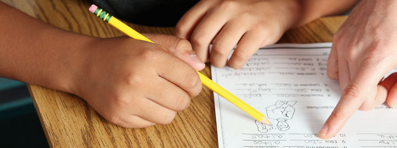 Teacher Helping Student