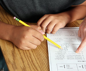 Teacher Helping Student
