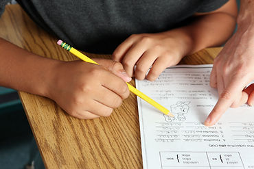 Teacher Helping Student