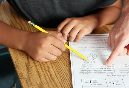 Teacher Helping Student