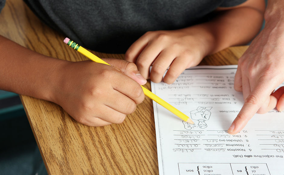 Teacher Helping Student