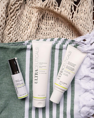 Ultraceuticals acne serum and two skincare tubes
