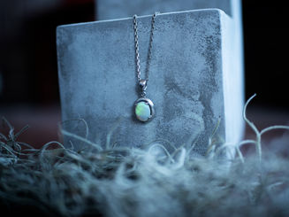 Silver necklace with an oval opal pendant