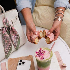 Woman Eating A Pink Donut As A Snack, Afternoon Cravings: A Midlife Guide To PMS, Perimenopause & Stress Eating