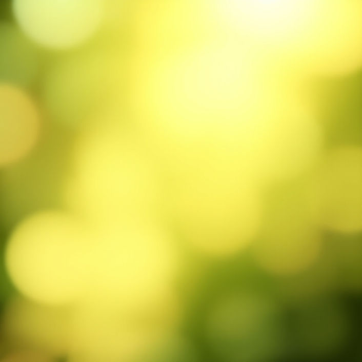 Soft, luminous background in  green tones, blended with warm beige and golden light accent