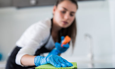 young-smiling-woman-cleans-kitchen-her-home-scaled-958x575.jpg