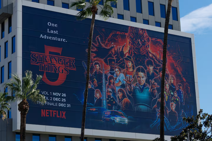 The Netflix logo and an advertisement for Stranger Things are shown on one of their buildings in the Hollywood neighborhood of Los Angeles, California, U.S., December 2, 2025. REUTERS/Mike Blake Purchase Licensing Rights