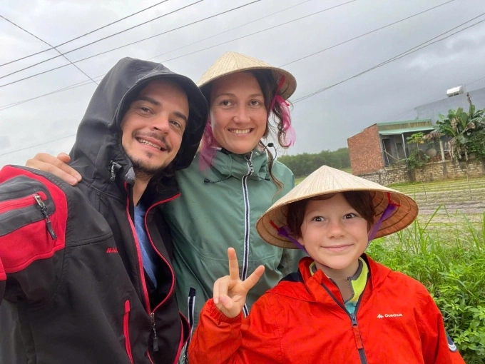 Ariane Triconnet (C), from France, her husband and their son in a farming experience in Da Nang, central Vietnam. Photo courtesy of Triconnet
