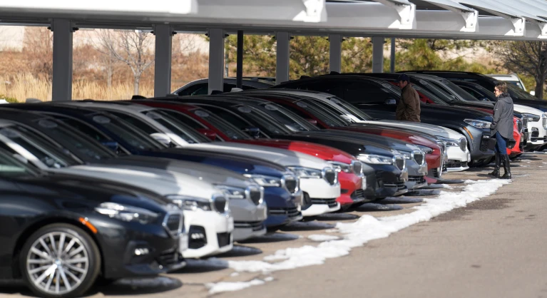 Unsold 2023 and 2024 models sit on display outside a BMW dealership on Thursday, Nov. 30, 2023, in Loveland, Colo. (AP Photo/David Zalubowski, File)