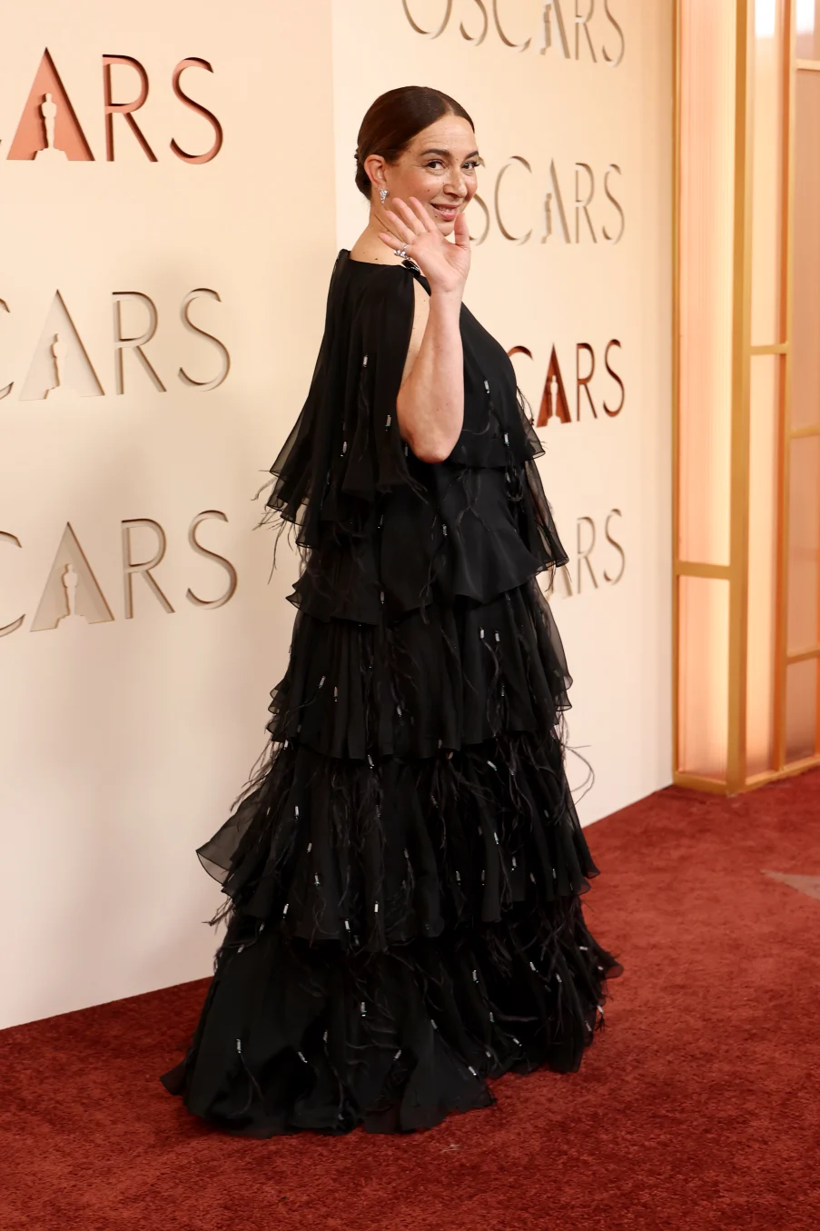 Maya Rudolph's silk crepe dress from Chanel was embroidered with crystals, malachite beads and feathers.Arturo Holmes/Getty Images)