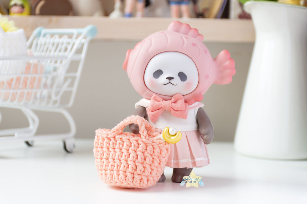 panda figurine with a basket in front