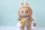 a plush modelling the white sunflower bag front view