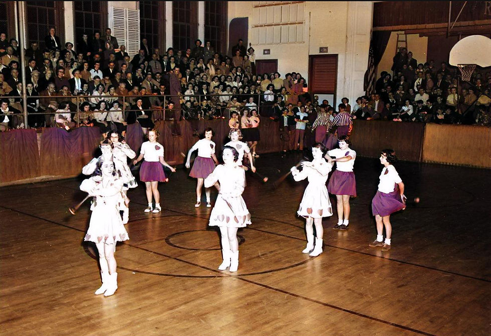 Majorettes performing at half-time during Rogers City vs. Alpena include Barbara Conjonte, Pat Hilla, Esther Patzer, Bernadette Hincka, Norma Klee, Donna Voigt, Carol Schlager, Sandra Chain, and Ida Mae Bruning.