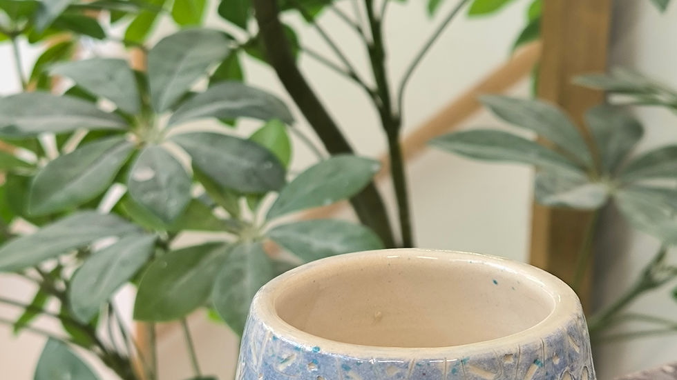 Eye-level view of a beautifully glazed ceramic bowl on display