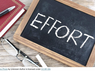 effort written on a chalkboard