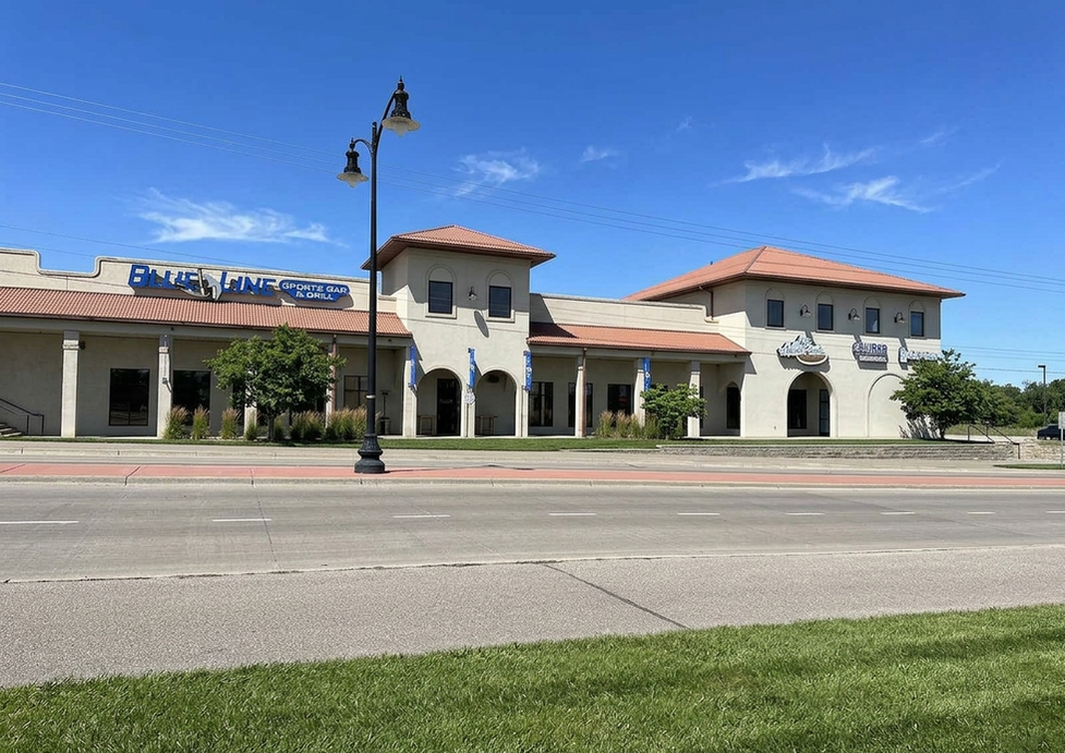 Commercial building with "Blue Lounge Club" sign.