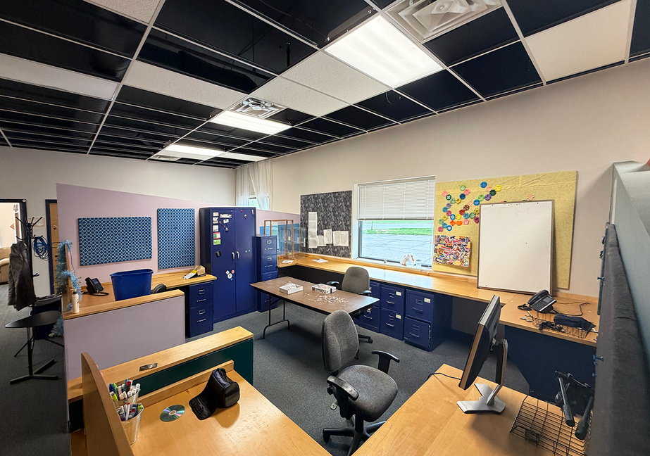 Climb Theatre office interior with multiple workstations.