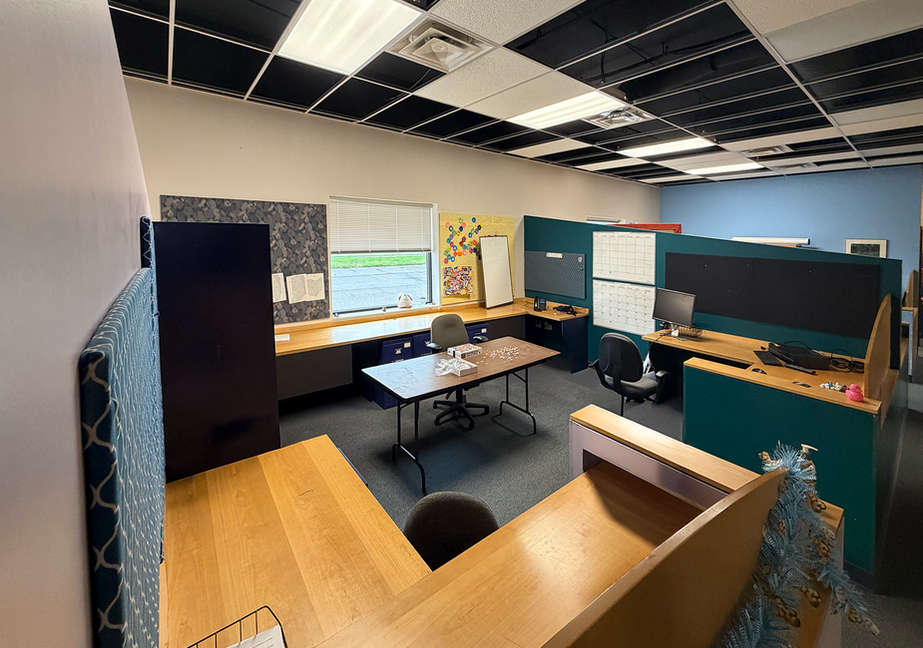 Climb Theatre office interior with workstations.